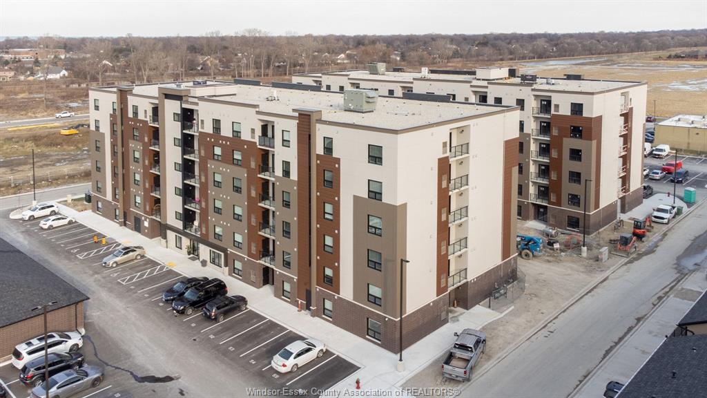 MLS# 26022791: 716 BROWNSTONE  Unit# 105, Tecumseh, Canada