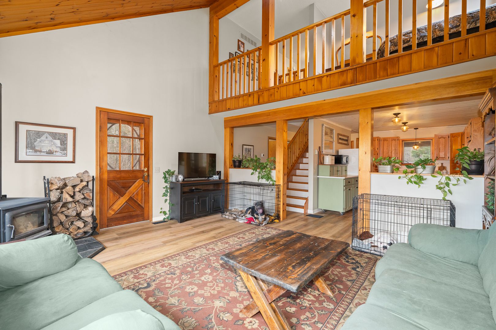 Family room with wood stove and vaulted ceiling at 621 Chapman Strong Road